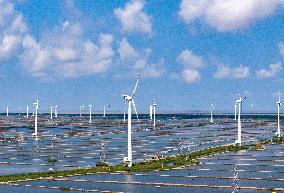 Wind Turbines Rotate in Vast Coastal Flat in Yancheng