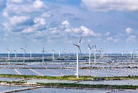 Wind Turbines Rotate in Vast Coastal Flat in Yancheng