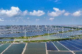 Wind Turbines Rotate in Vast Coastal Flat in Yancheng