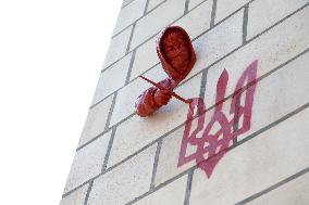 Sculpture by French street artist James Colomina on Central Post Offices wall in Kyiv