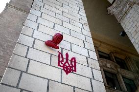 Sculpture by French street artist James Colomina on Central Post Offices wall in Kyiv