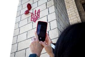 Sculpture by French street artist James Colomina on Central Post Offices wall in Kyiv