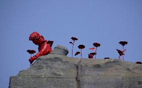 'Girl with Sunflowers' sculpture by French street artist James Colomina in Kyiv