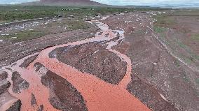 Red Rivers Flow Through Grassland in Haixi