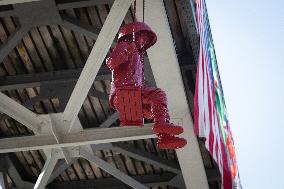 Sculpture of girl on swing by James Colomina in Kyiv