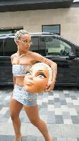 Doja Cat With A Clay Version Of Her Own Head - London