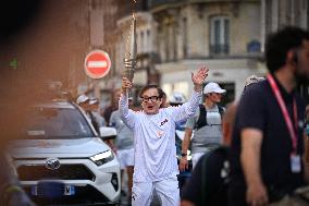 Paris 2024 Paralympics - Jackie Chan Carries The Flame - Paris