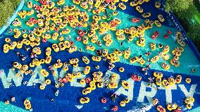 Tourists Cool Off on Rubber Boats at A Water Park in Shenyang