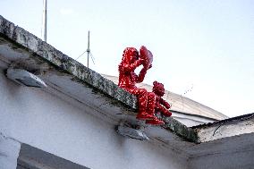 Sculpture of child with heart and teddy bear by James Colomina in Kyiv