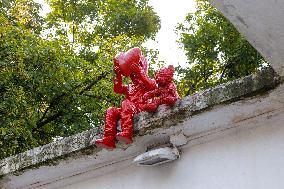 Sculpture of child with heart and teddy bear by James Colomina in Kyiv