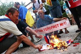 Protesters Burn The Russian Flag