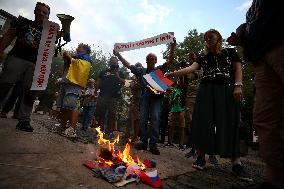 Protesters Burn The Russian Flag