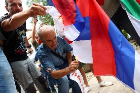 Protesters Burn The Russian Flag