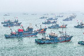 Fishing boats departing from a port for fishing in Rongcheng City