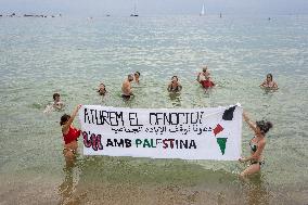 The "Swim With Gaza" Initiative On The Beach Of Barcelona.