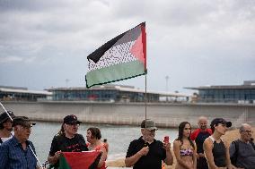 The "Swim With Gaza" Initiative On The Beach Of Barcelona.