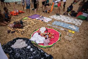 The "Swim With Gaza" Initiative On The Beach Of Barcelona.