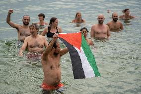 The "Swim With Gaza" Initiative On The Beach Of Barcelona.