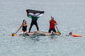 The "Swim With Gaza" Initiative On The Beach Of Barcelona.