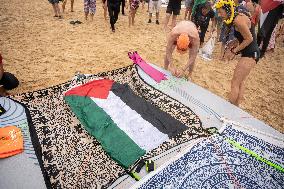 The "Swim With Gaza" Initiative On The Beach Of Barcelona.