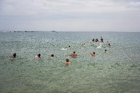 The "Swim With Gaza" Initiative On The Beach Of Barcelona.