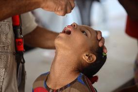 Palestinian Child Receives Polio Vaccine at UK-MED Hospital in Gaza Amid Ongoing Conflict