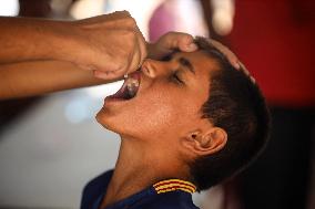 Palestinian Child Receives Polio Vaccine at UK-MED Hospital in Gaza Amid Ongoing Conflict