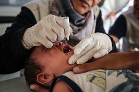 Palestinian Child Receives Polio Vaccine at UK-MED Hospital in Gaza Amid Ongoing Conflict