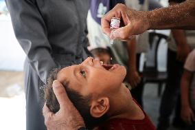 Palestinian Child Receives Polio Vaccine at UK-MED Hospital in Gaza Amid Ongoing Conflict