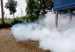 A Worker Fumigates To Prevent The Spread Of Dengue Fever