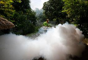 A Worker Fumigates To Prevent The Spread Of Dengue Fever