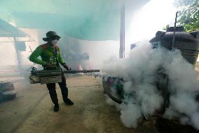 A Worker Fumigates To Prevent The Spread Of Dengue Fever