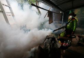 A Worker Fumigates To Prevent The Spread Of Dengue Fever