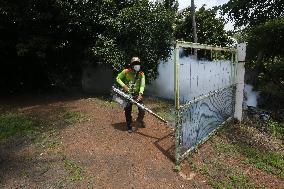 A Worker Fumigates To Prevent The Spread Of Dengue Fever