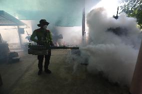 A Worker Fumigates To Prevent The Spread Of Dengue Fever