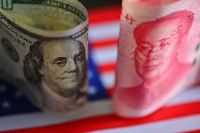 U.S. Dollar And Chinese Yuan Banknotes