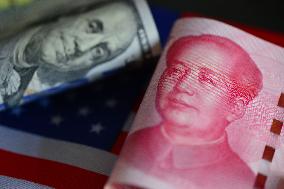 U.S. Dollar And Chinese Yuan Banknotes