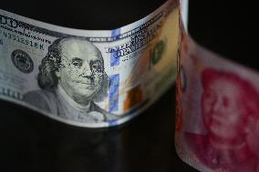 U.S. Dollar And Chinese Yuan Banknotes