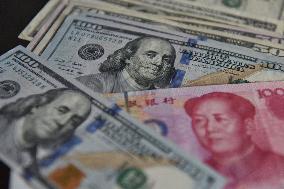 U.S. Dollar And Chinese Yuan Banknotes