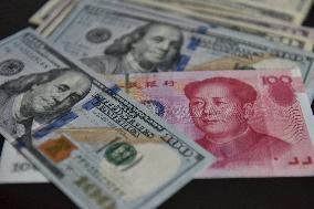 U.S. Dollar And Chinese Yuan Banknotes