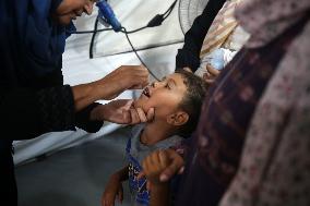 Palestinian Child Receives Polio Vaccination at UK-MED Field Hospital in Khan Younis Amid Conflict