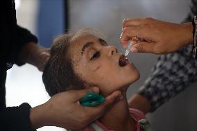 Palestinian Child Receives Polio Vaccination at UK-MED Field Hospital in Khan Younis Amid Conflict