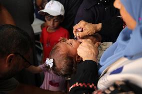 Palestinian Child Receives Polio Vaccination at UK-MED Field Hospital in Khan Younis Amid Conflict