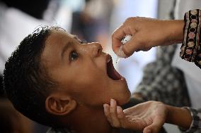 Palestinian Child Receives Polio Vaccination at UK-MED Field Hospital in Khan Younis Amid Conflict