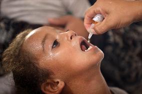 Palestinian Child Receives Polio Vaccination at UK-MED Field Hospital in Khan Younis Amid Conflict