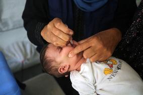 Palestinian Child Receives Polio Vaccination at UK-MED Field Hospital in Khan Younis Amid Conflict