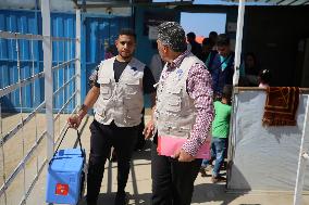 Palestinian Child Receives Polio Vaccination at UK-MED Field Hospital in Khan Younis Amid Conflict