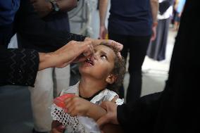 Palestinian Child Receives Polio Vaccination at UK-MED Field Hospital in Khan Younis Amid Conflict