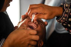 Palestinian Child Receives Polio Vaccination at UK-MED Field Hospital in Khan Younis Amid Conflict