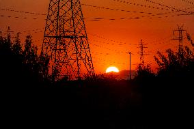 High Voltage Pylons During Sunset Time